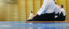 Aikido-Praktizierende in der Meditationshaltung